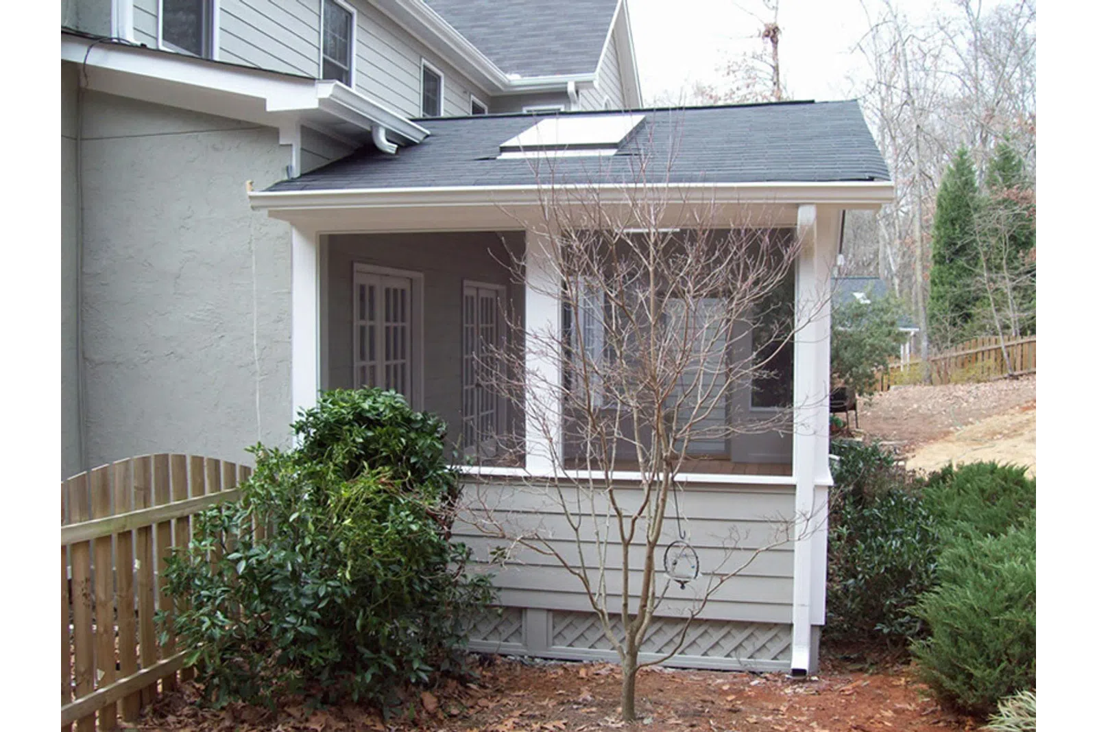 a house with a tree in the front yard