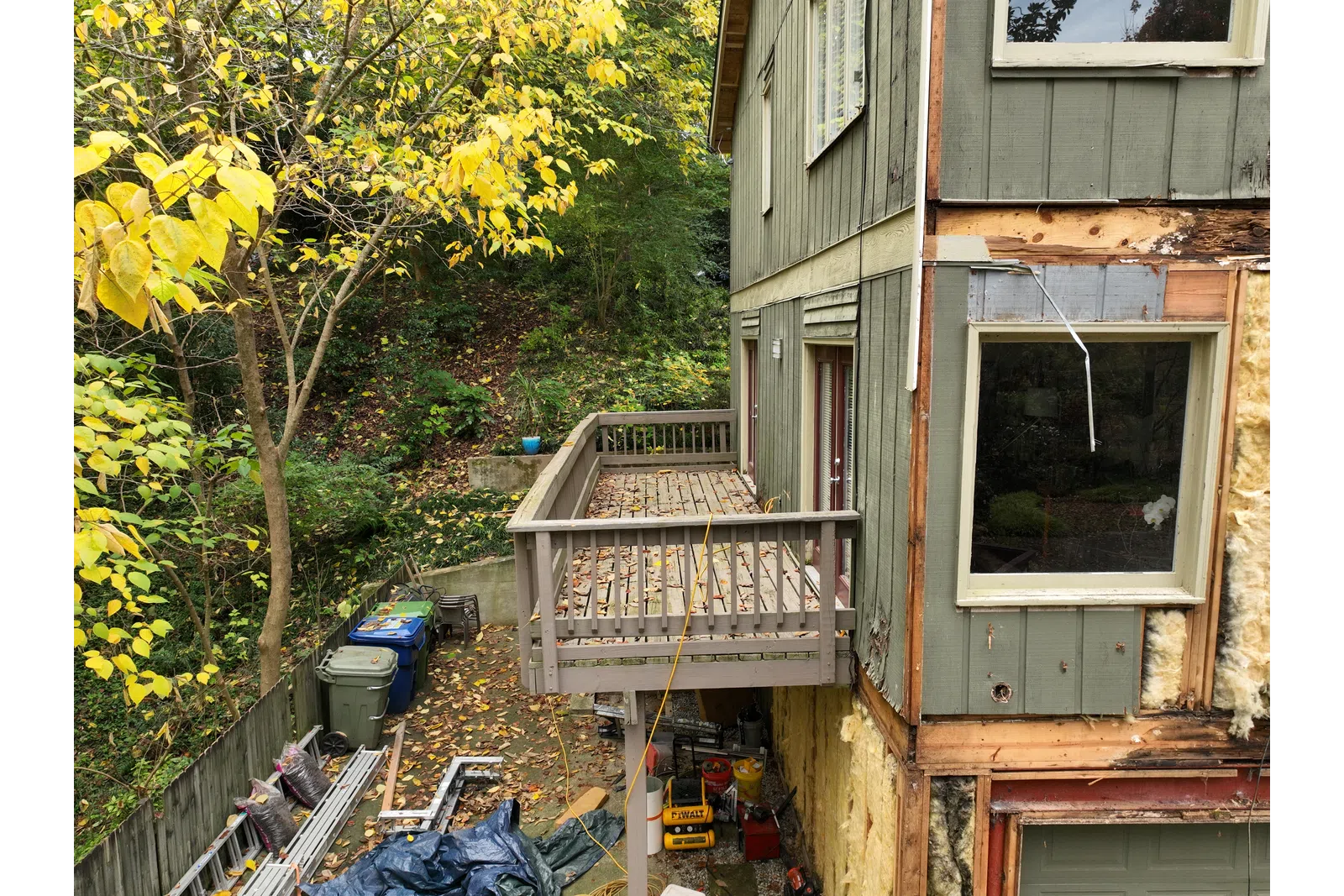 a house with a deck and trees