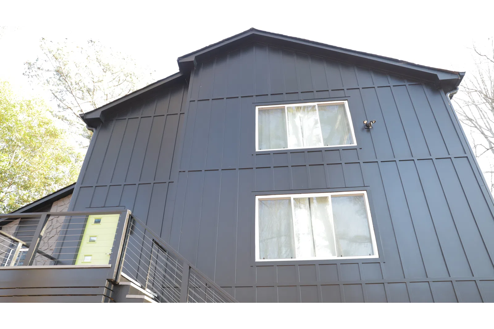 a grey house with windows
