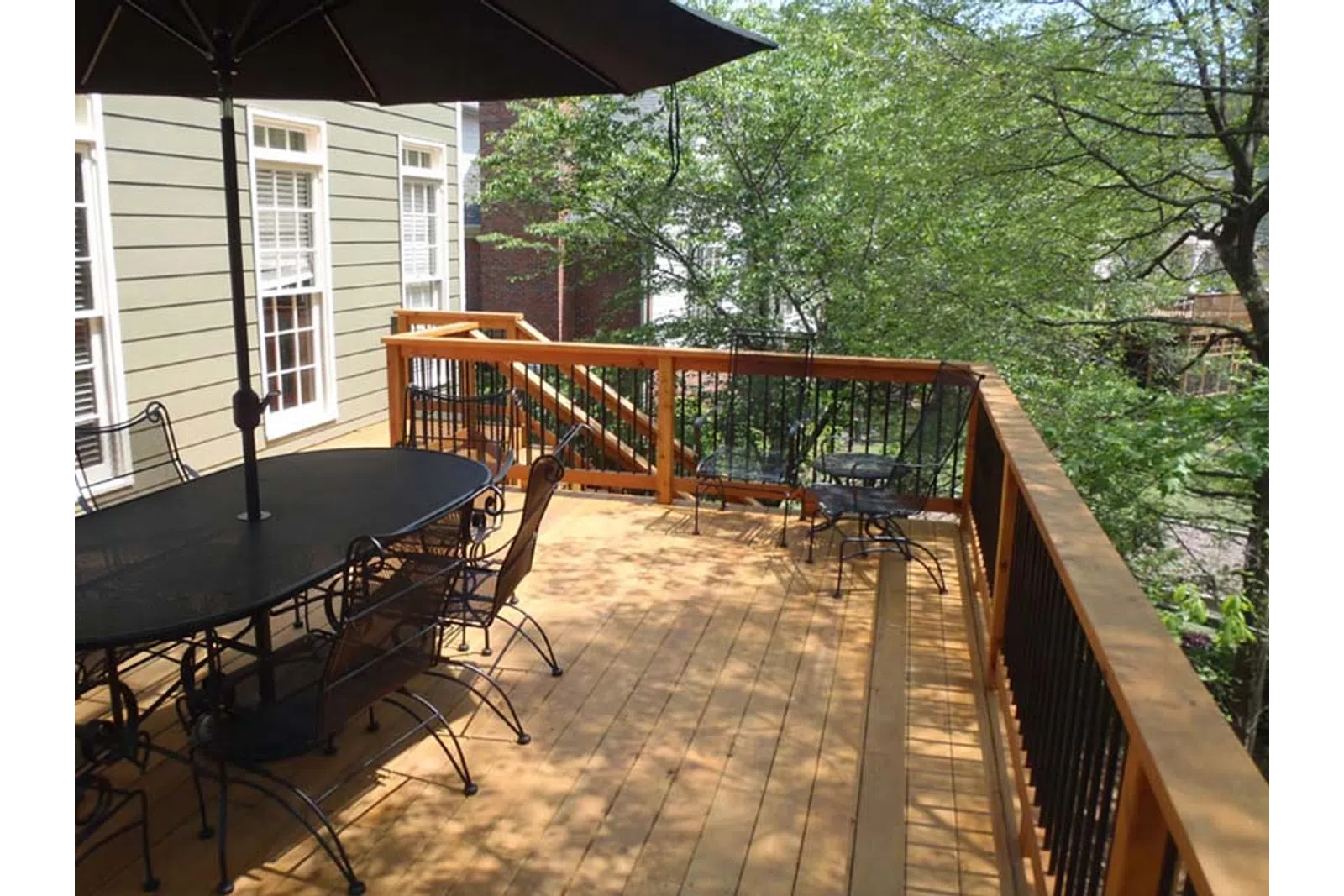 a deck with a table and chairs
