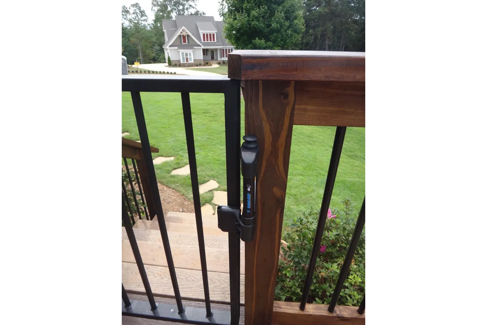 a parking meter on a wooden fence