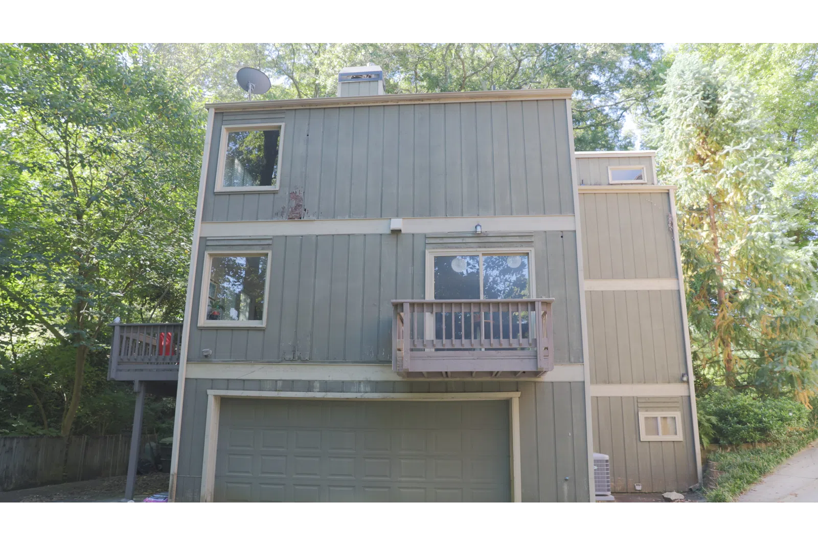 a wooden house with a balcony