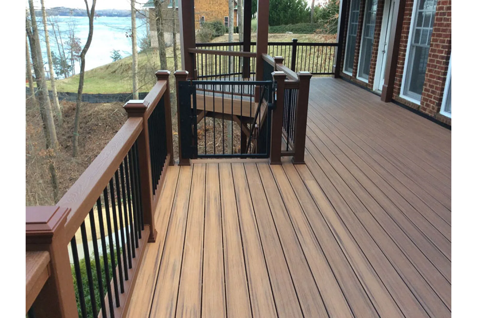 a deck with chairs and a table