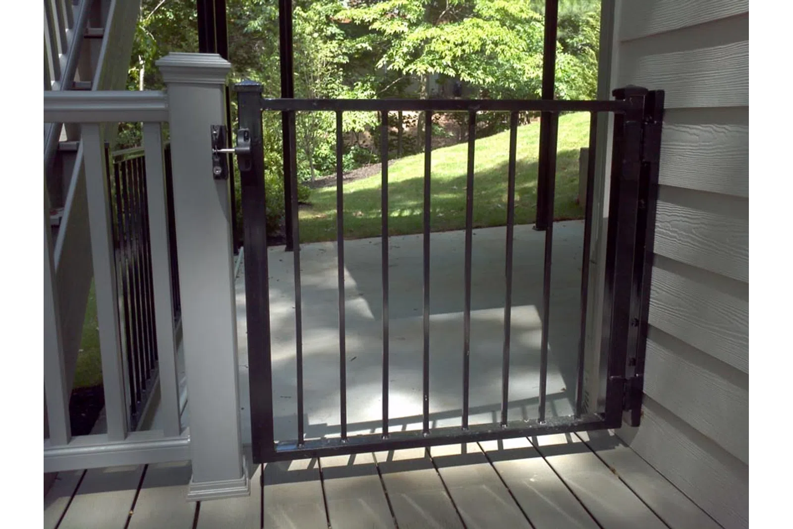 a glass door with a metal railing