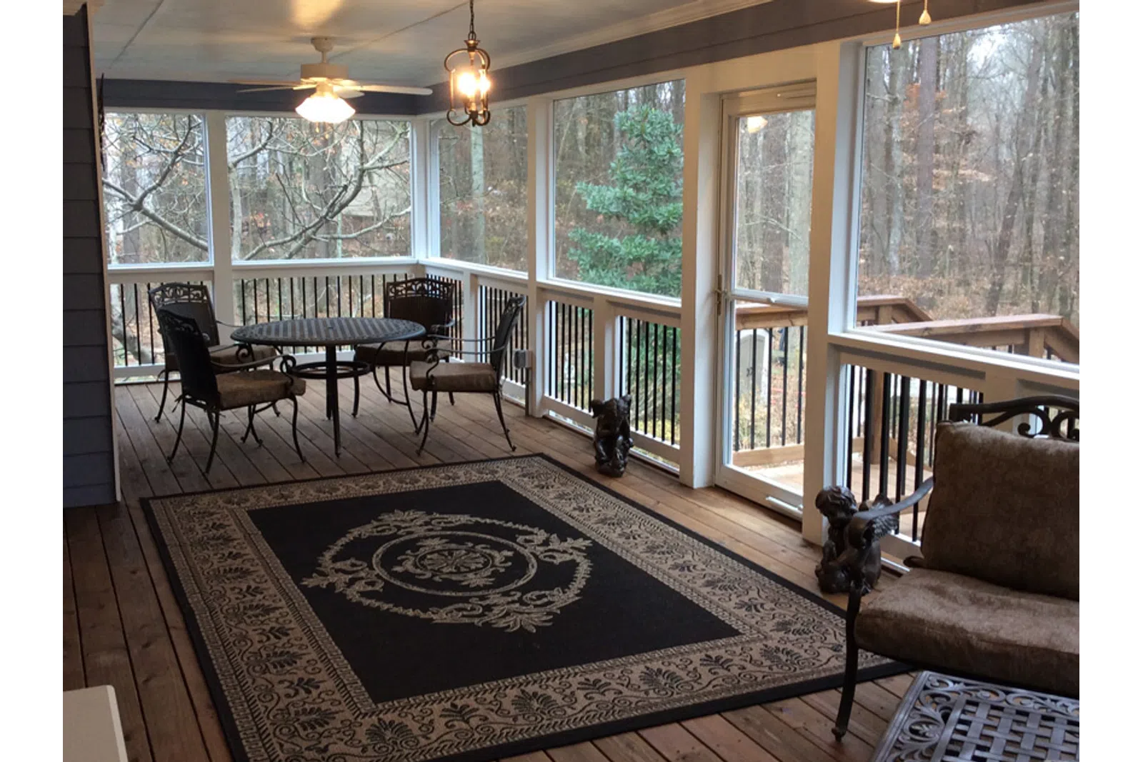 a living room with a rug and a table