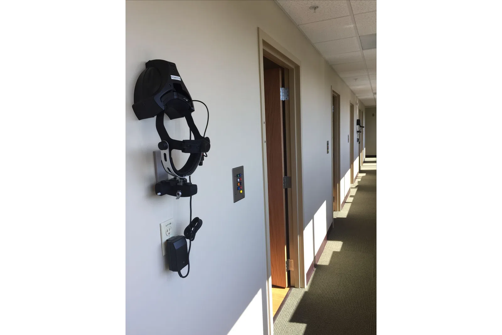 a hallway with a camera on the wall
