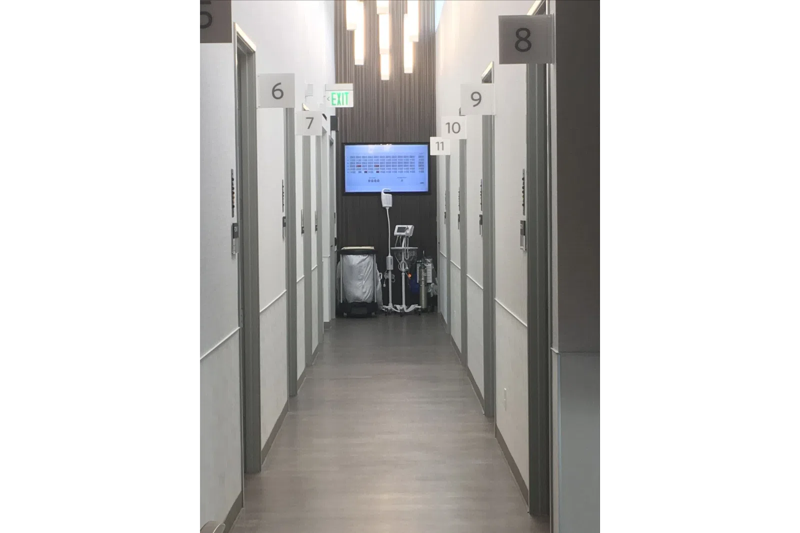 a hallway with a screen and lockers