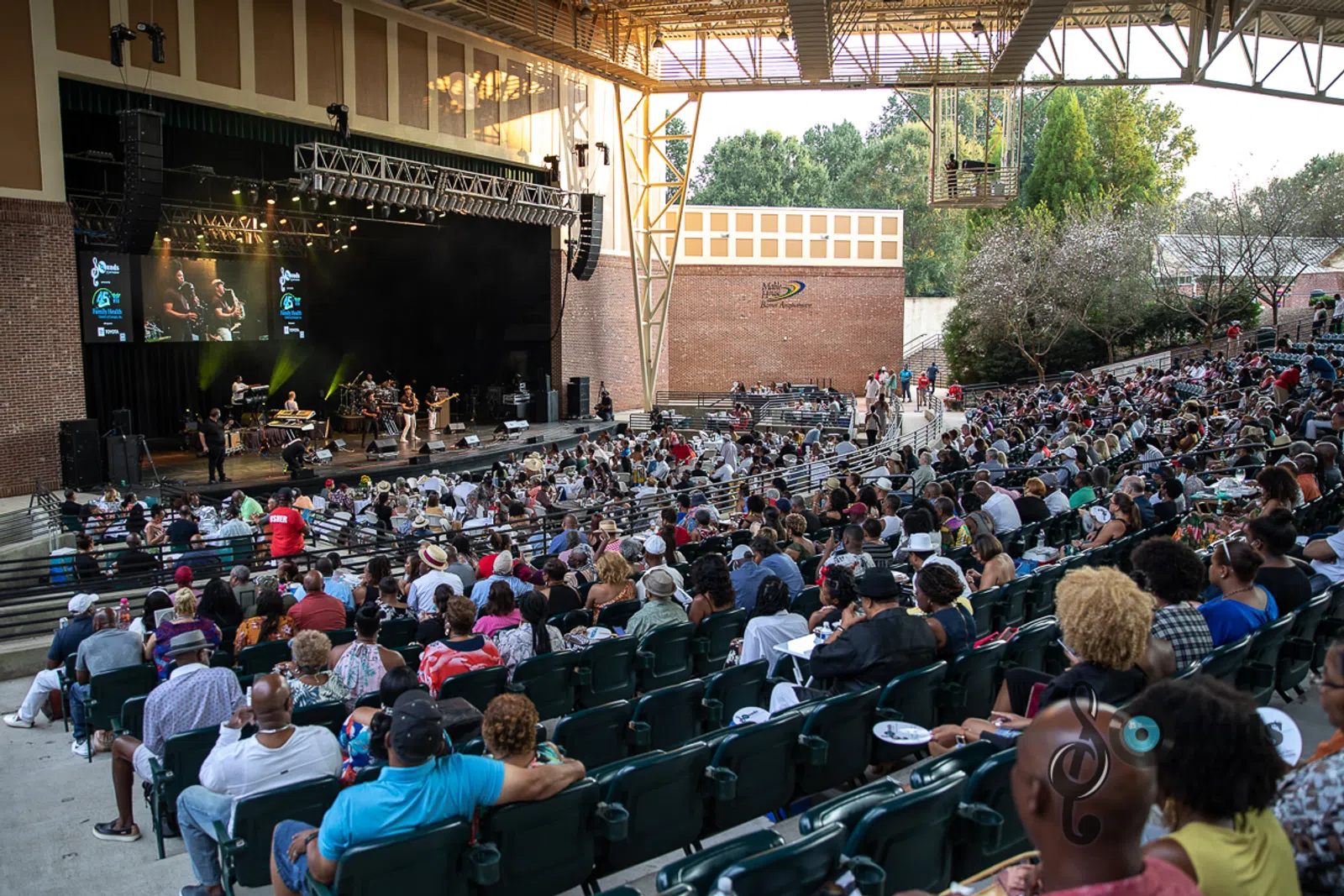 a group of people sitting in front of a crowd