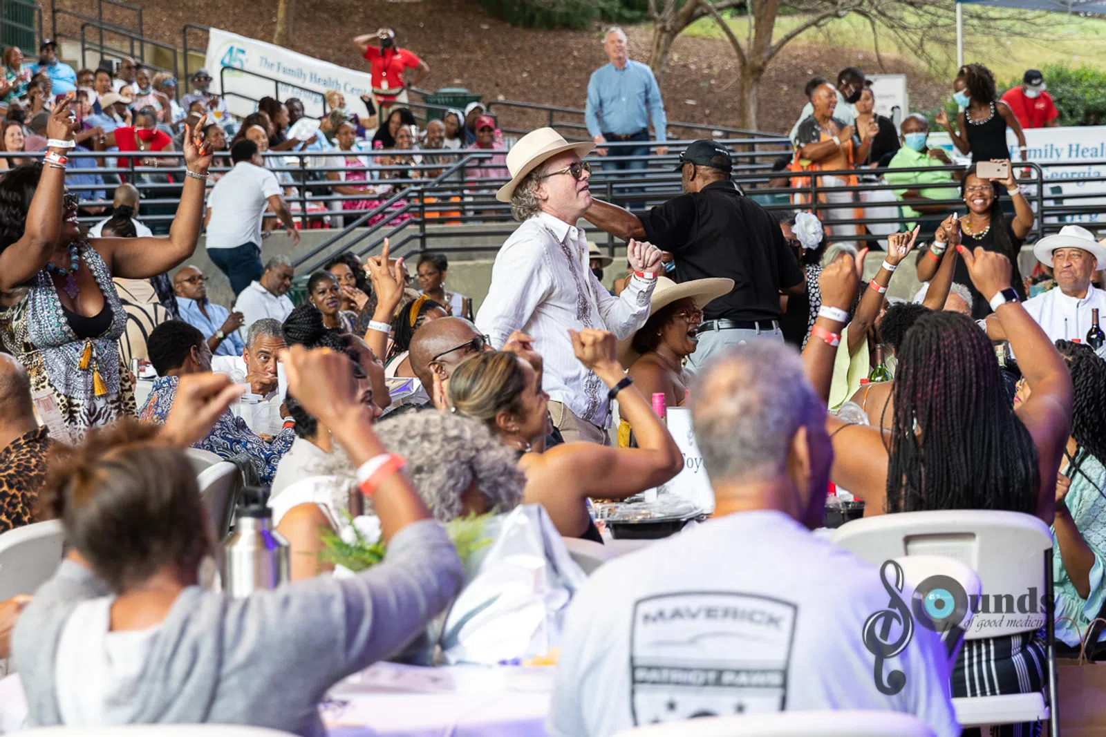 a group of people in front of a crowd