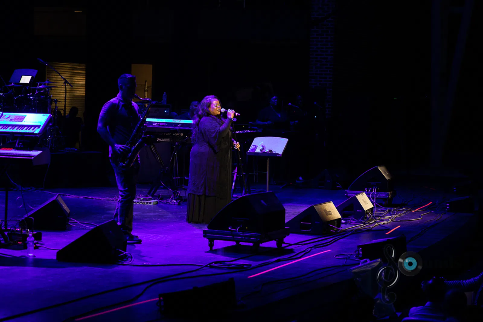 a person on a stage playing a video game