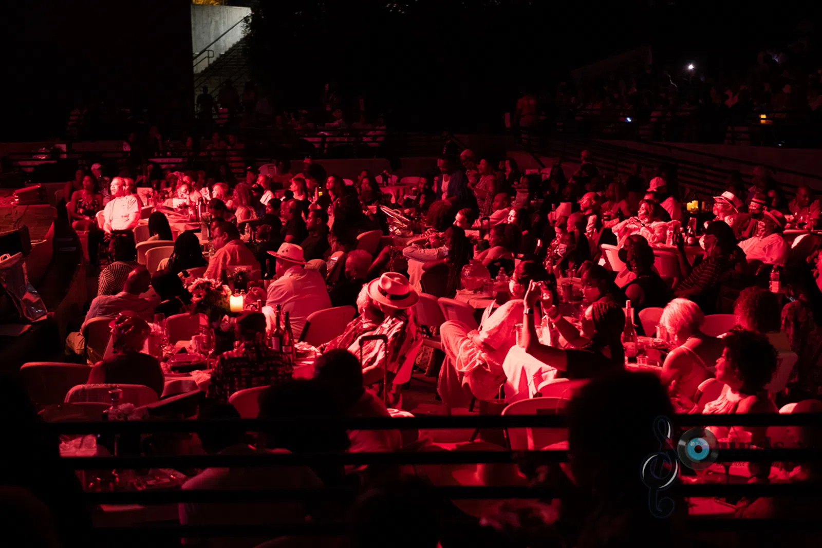 a group of people performing on stage in front of a crowd