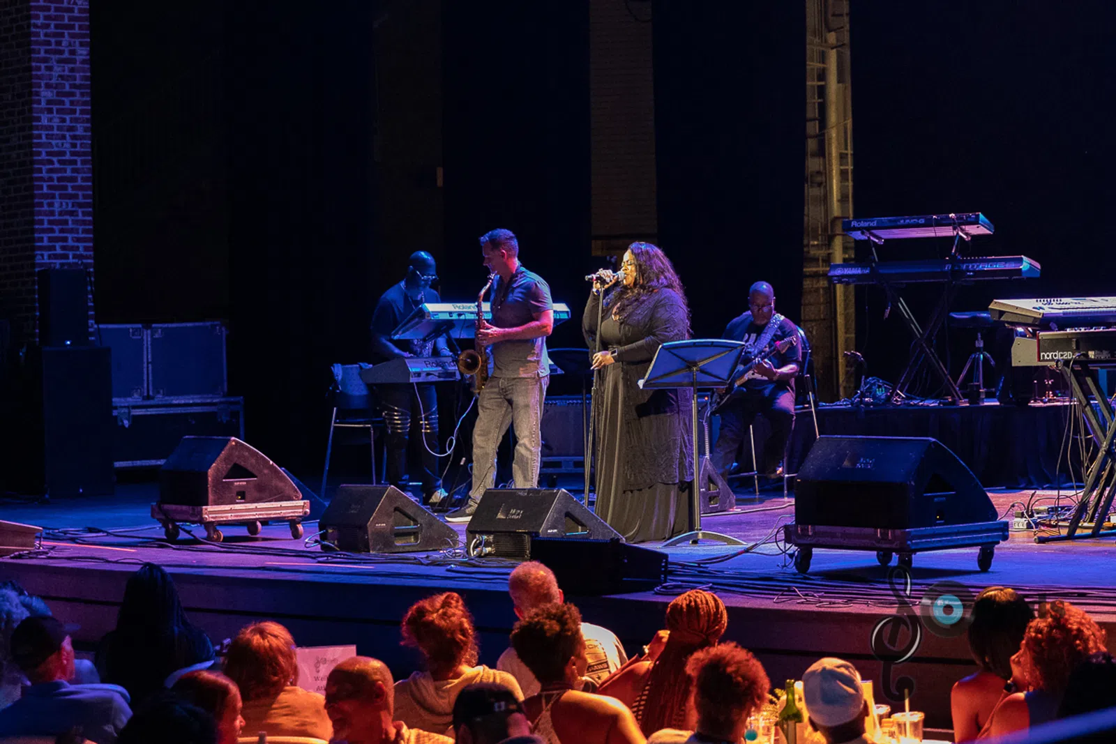 a group of people sitting on a stage