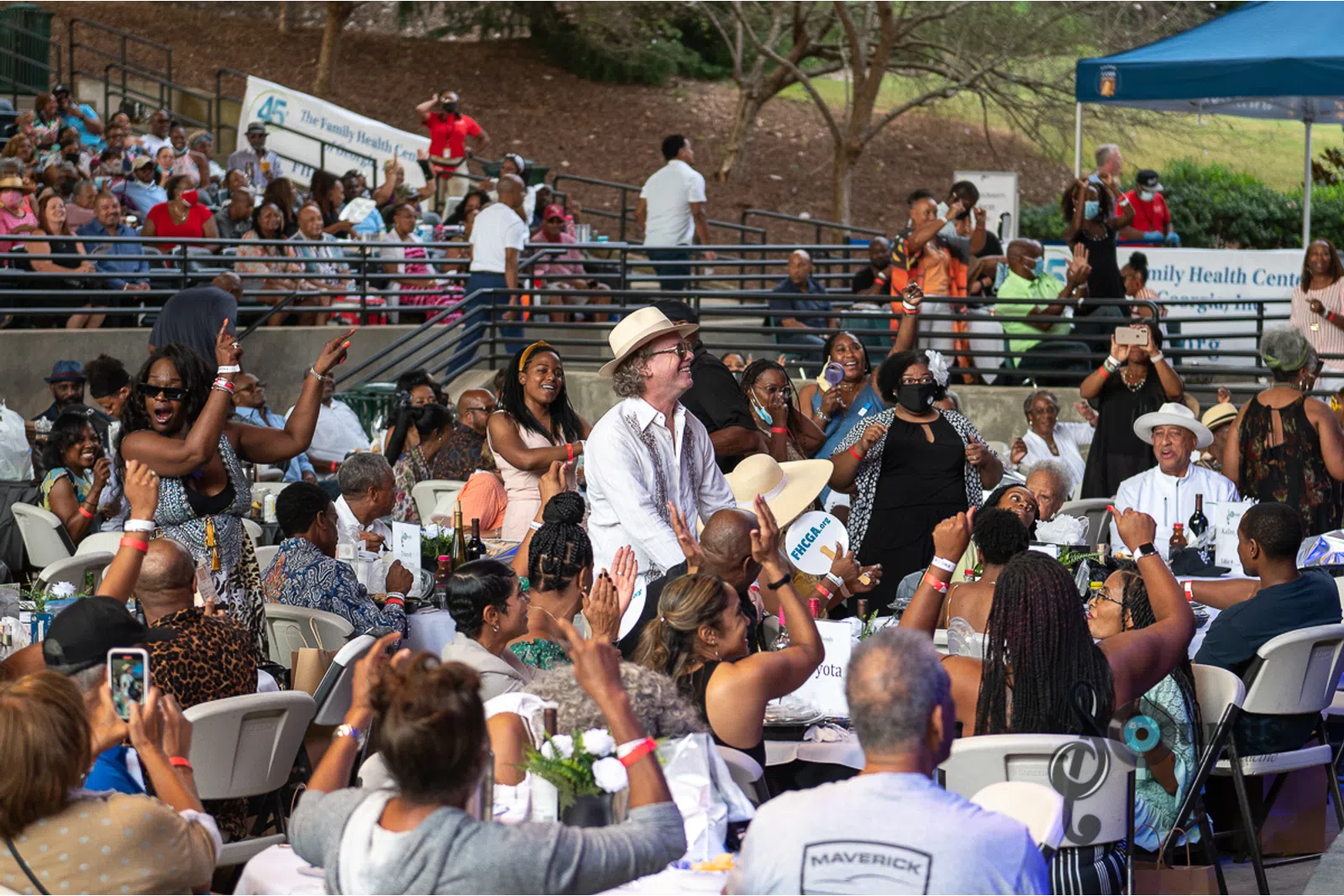 a group of people in front of a crowd
