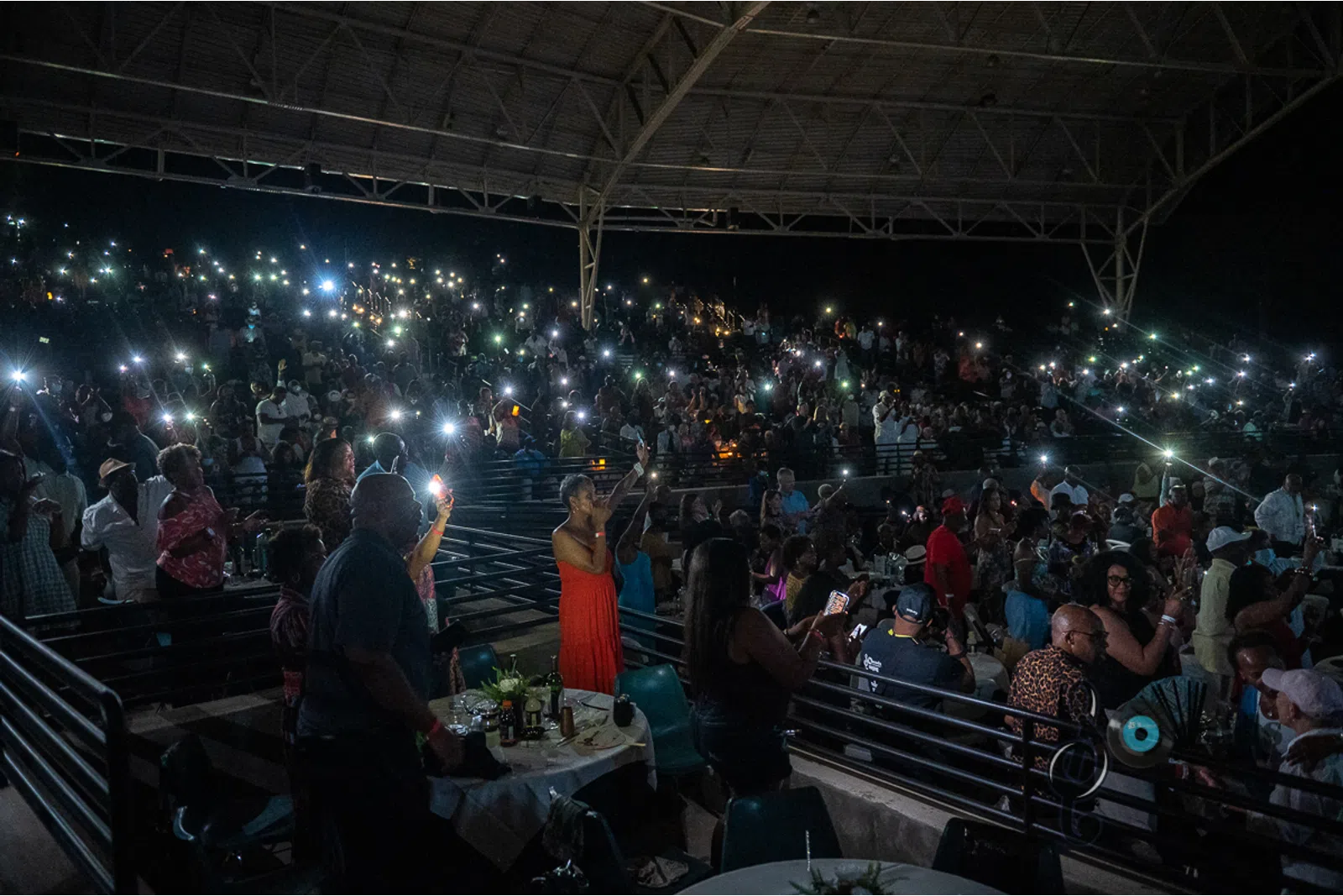 a group of people sitting in front of a crowd