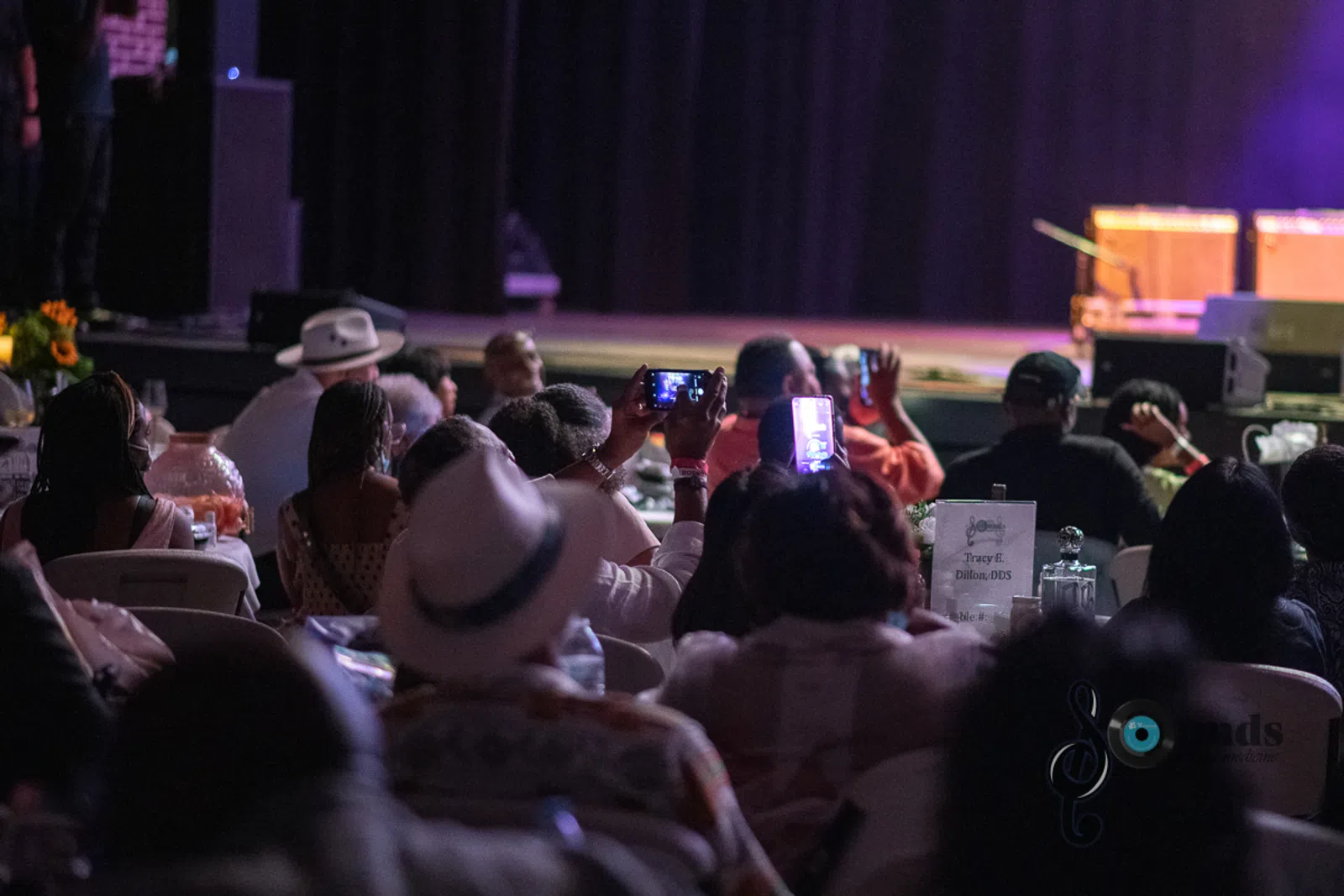 a group of people sitting in front of a crowd