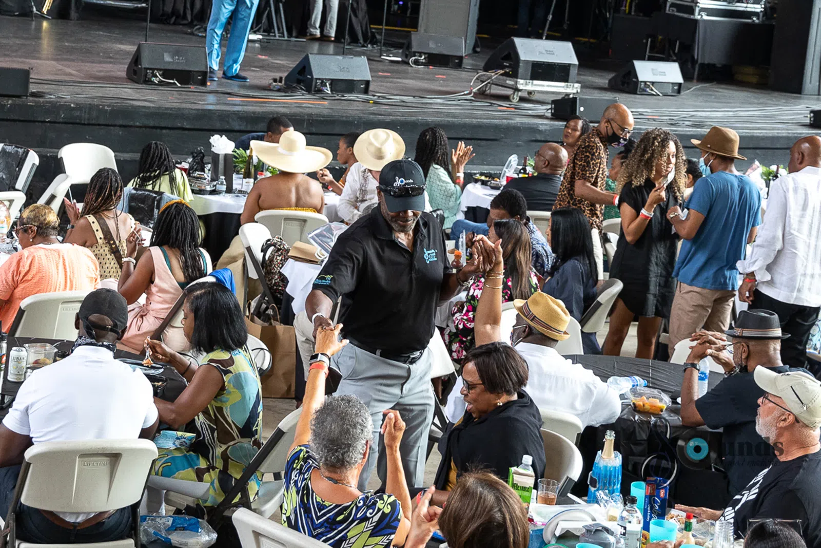 a group of people sitting in front of a crowd
