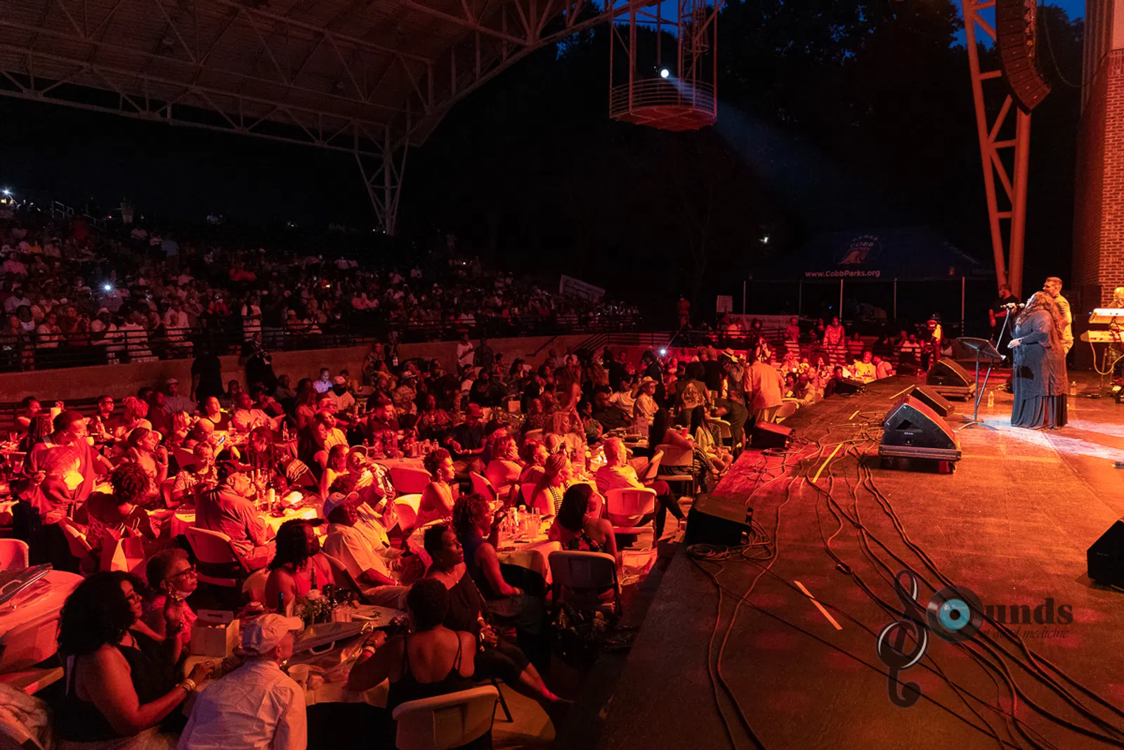a group of people on a stage in front of a crowd