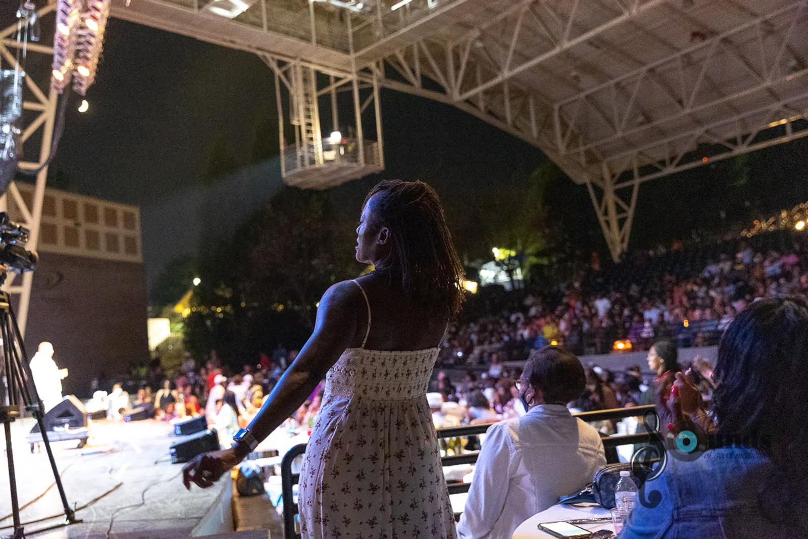 a person standing in front of a crowd