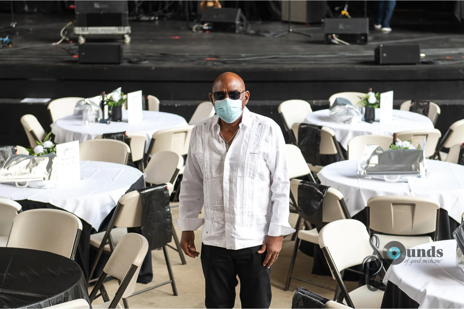 a man standing in front of a table