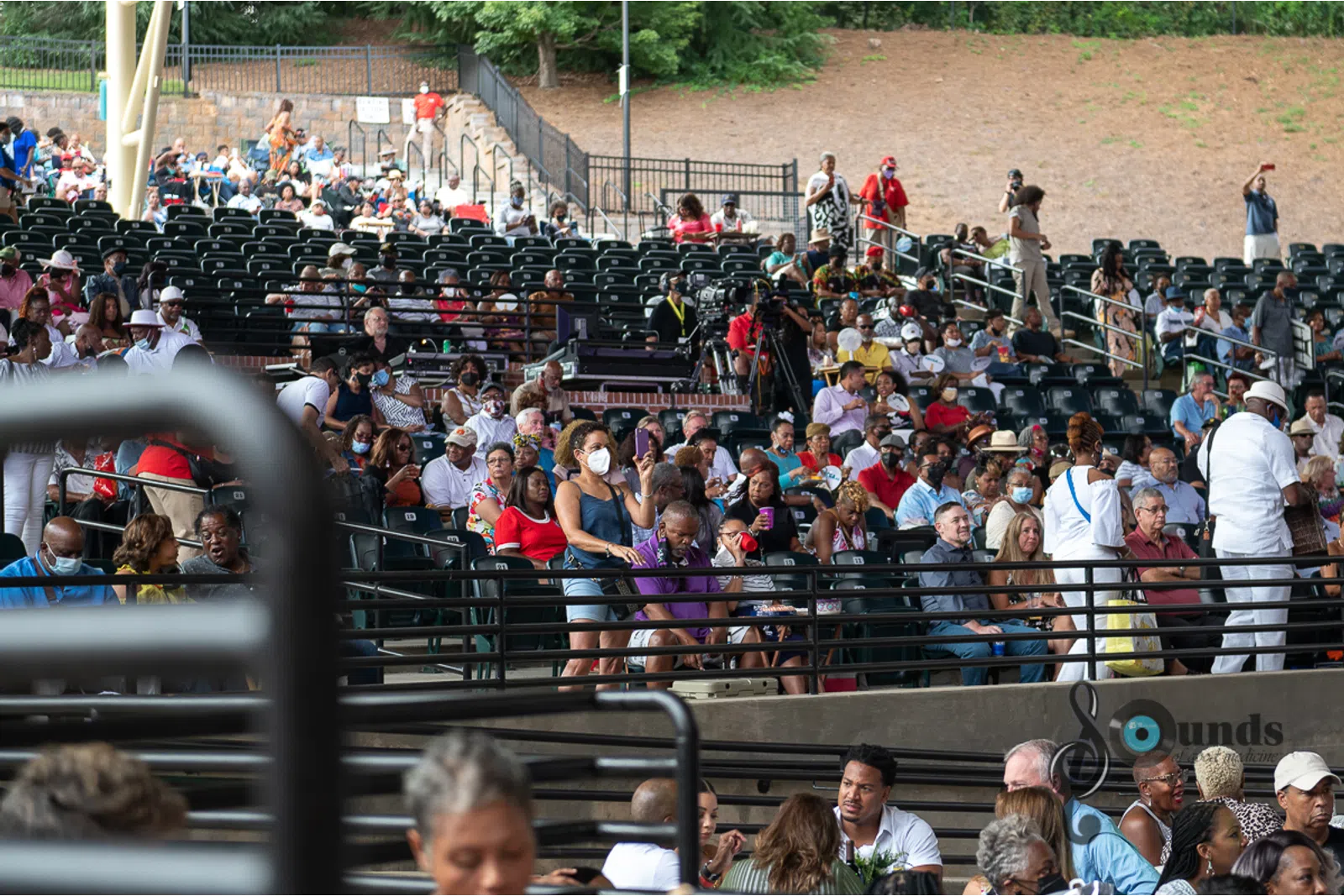 a group of people standing in front of a crowd