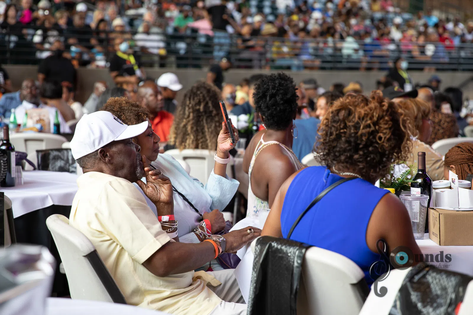 a group of people sitting in front of a crowd