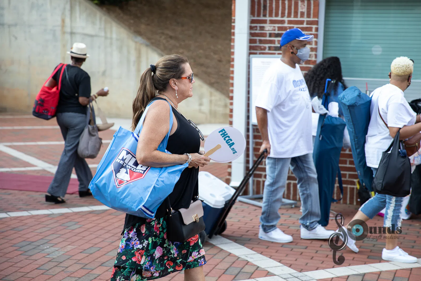 a group of people on a sidewalk