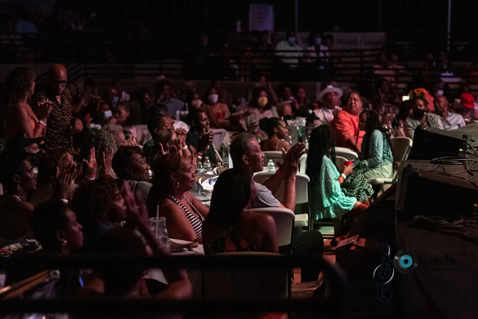 a group of people sitting in front of a crowd