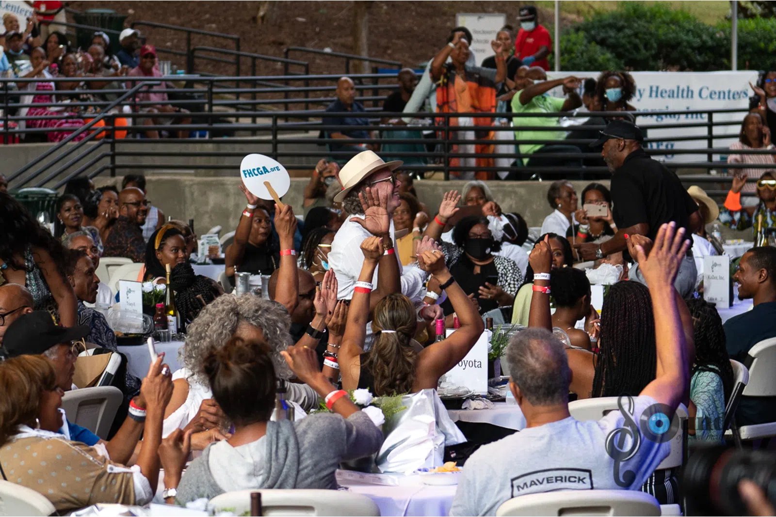 a group of people standing in front of a crowd