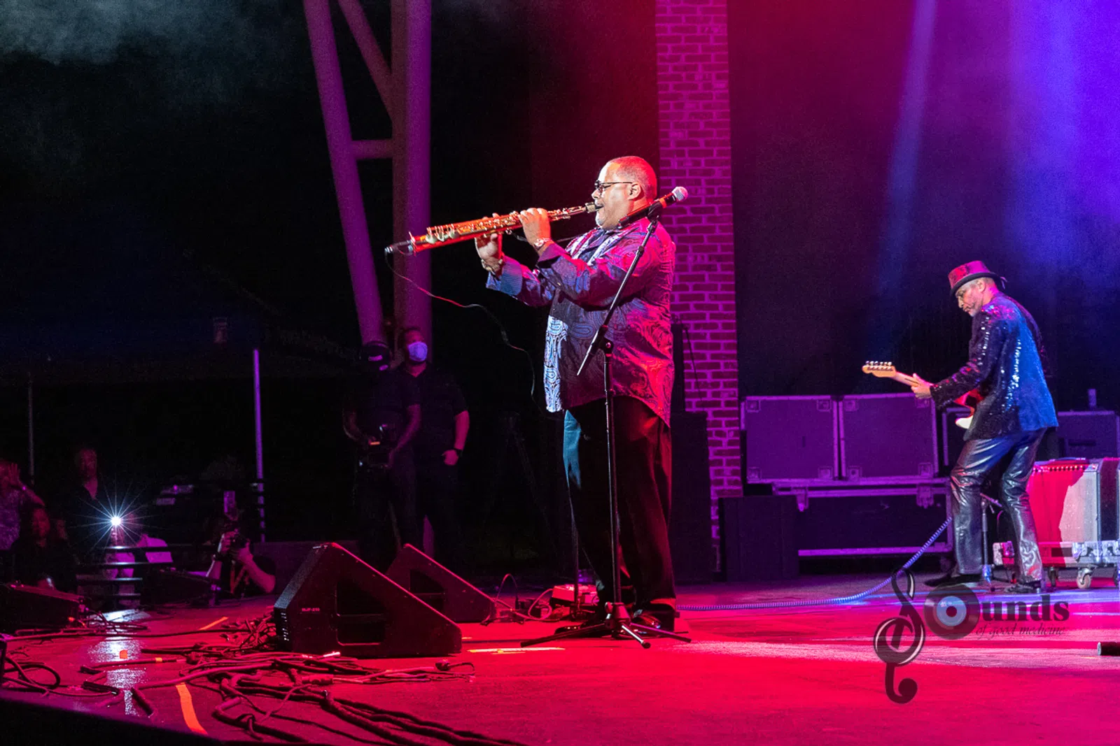 a person on a stage playing instruments