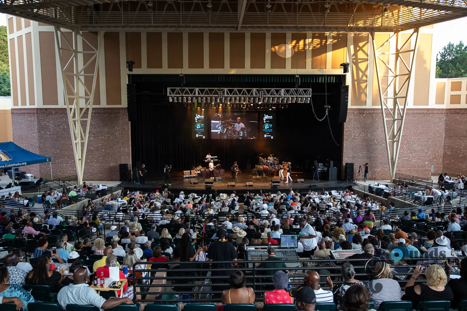 a group of people sitting in front of a crowd
