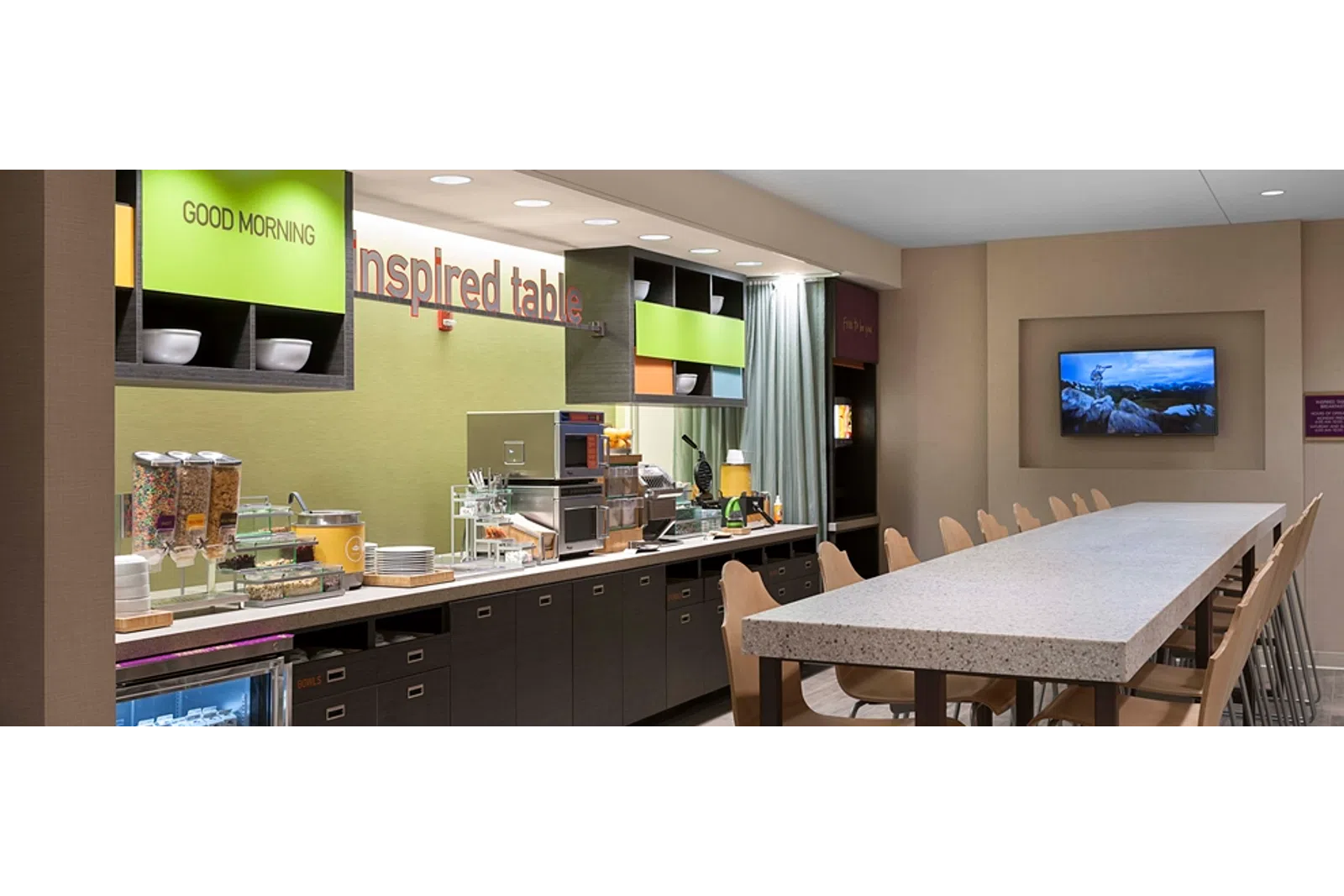 a kitchen with an island in the middle of a room