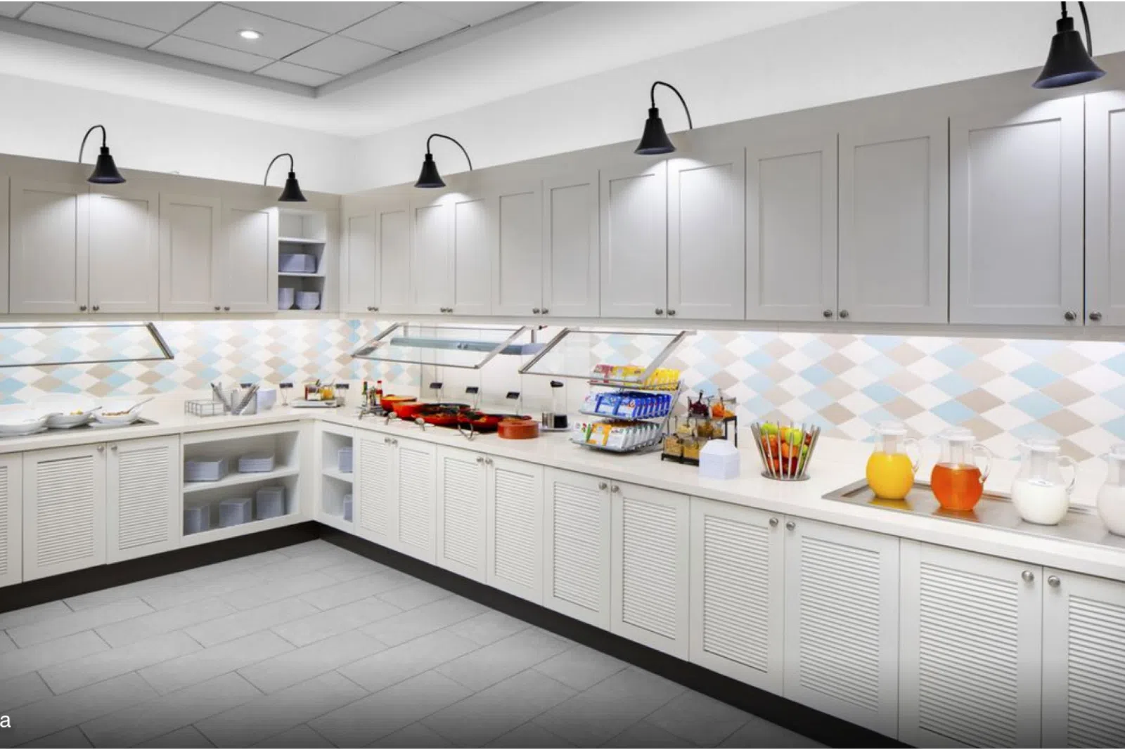 a large kitchen with stainless steel appliances
