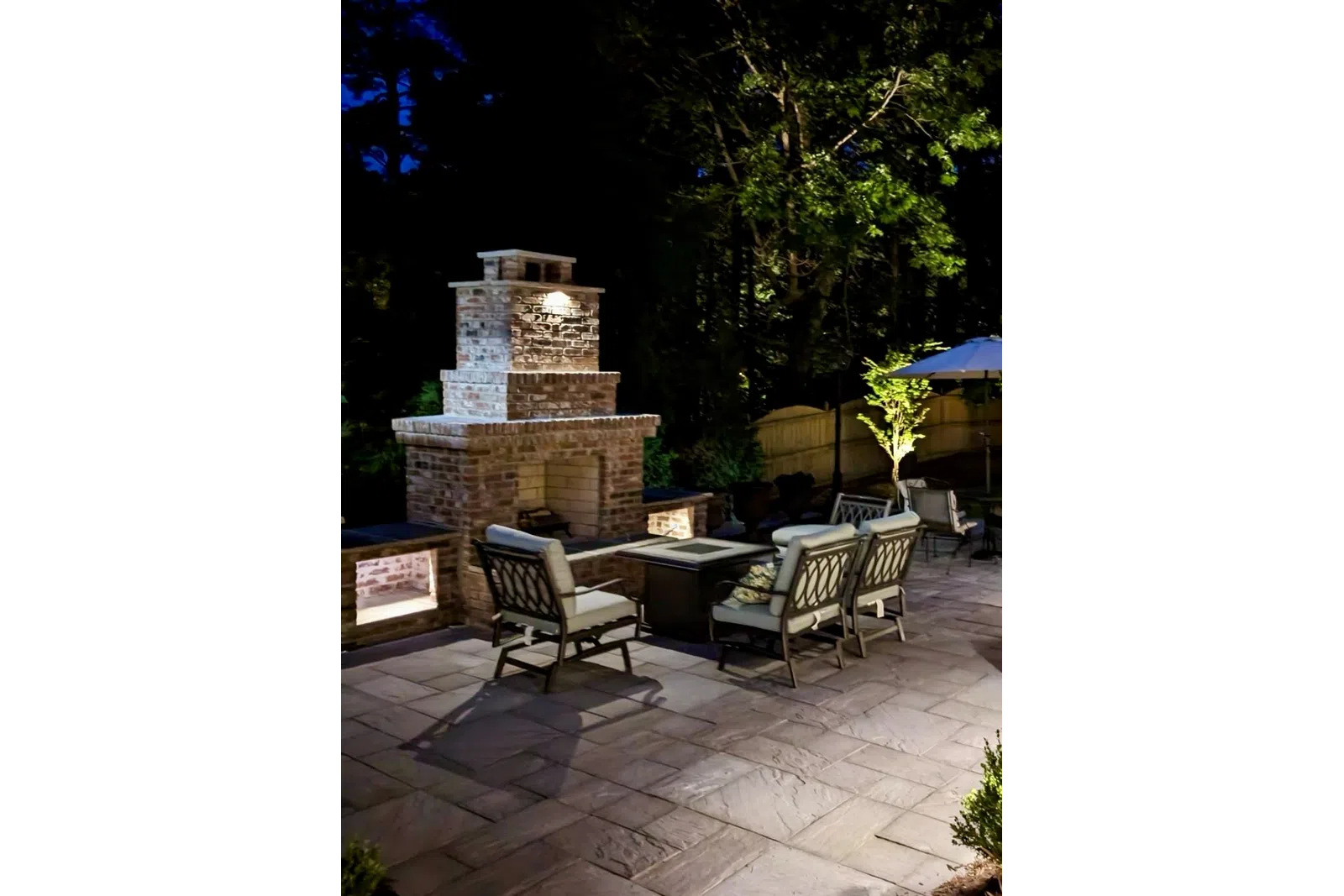 a patio with chairs and tables