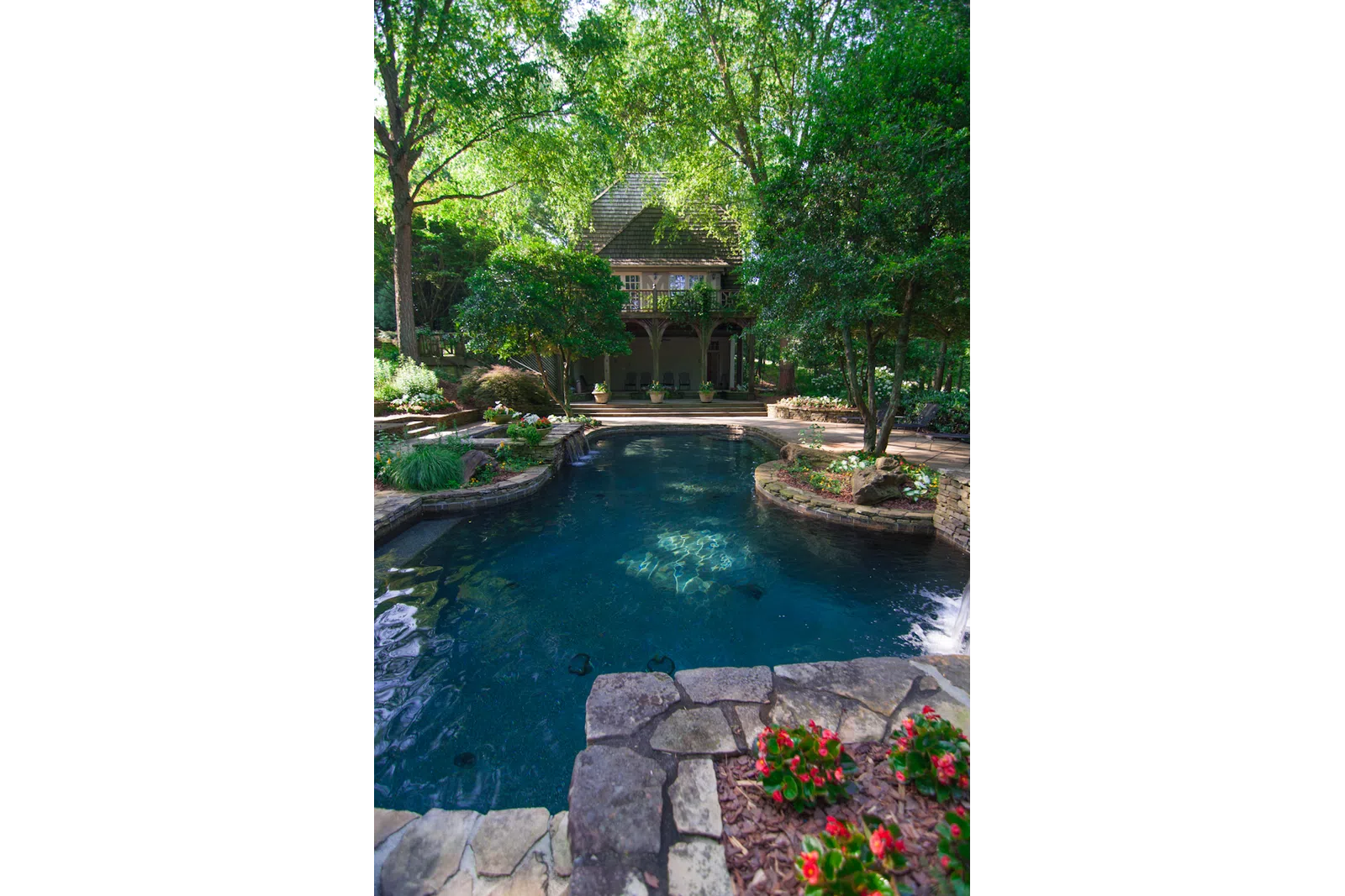 a pond with a house in the background