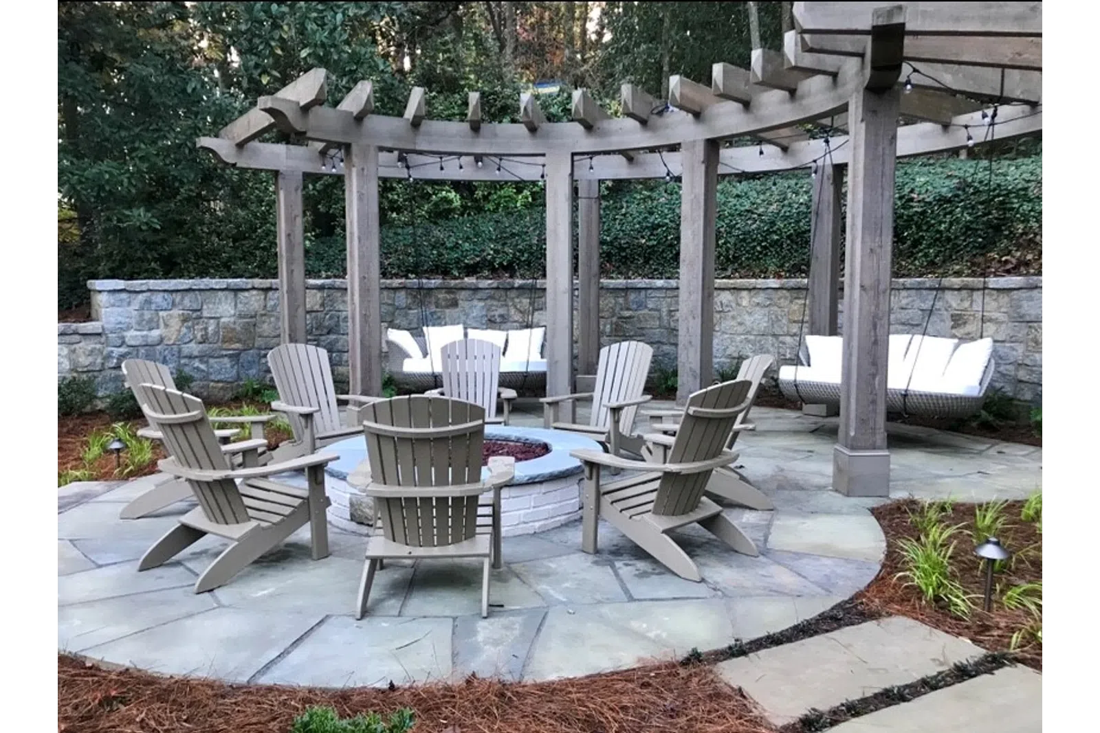 a patio with chairs and tables