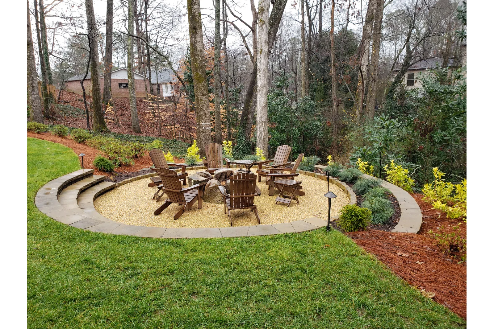a backyard with a table and chairs