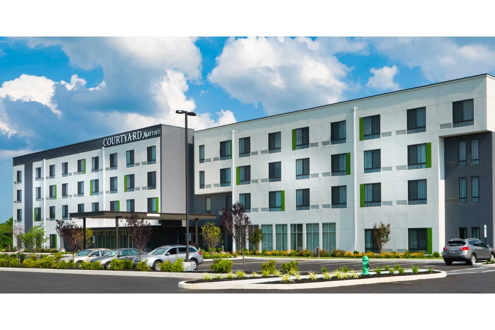 a building with cars parked in front