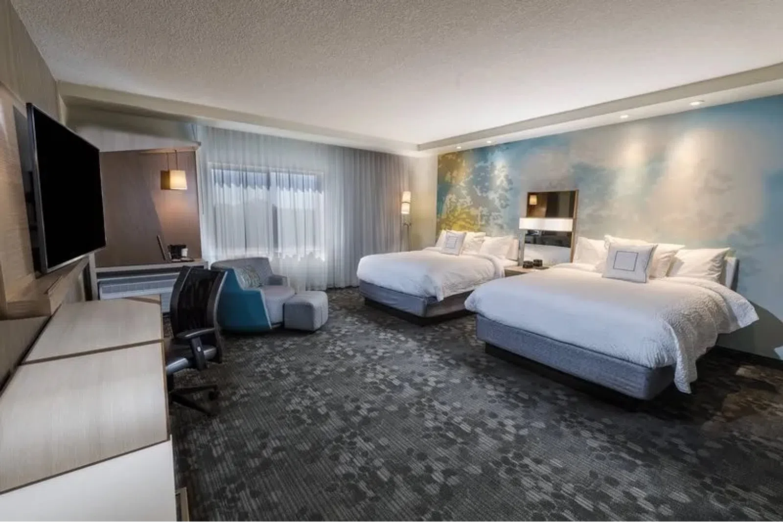 a hotel room with two beds