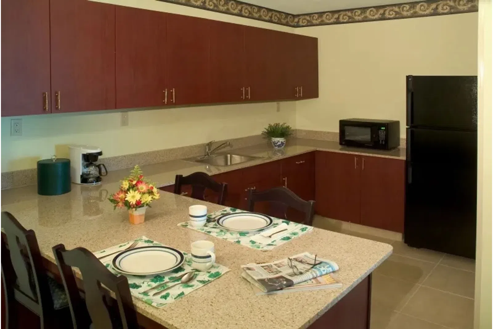 a kitchen with a table and chairs