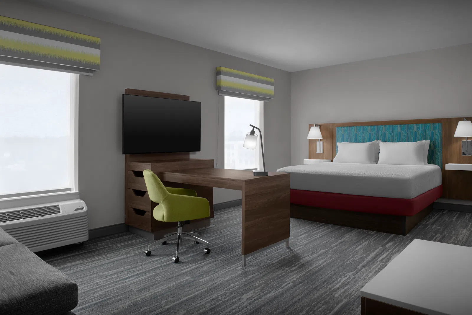 Modern hotel room with king bed, wooden desk, green swivel chair, TV, and natural light from two windows.