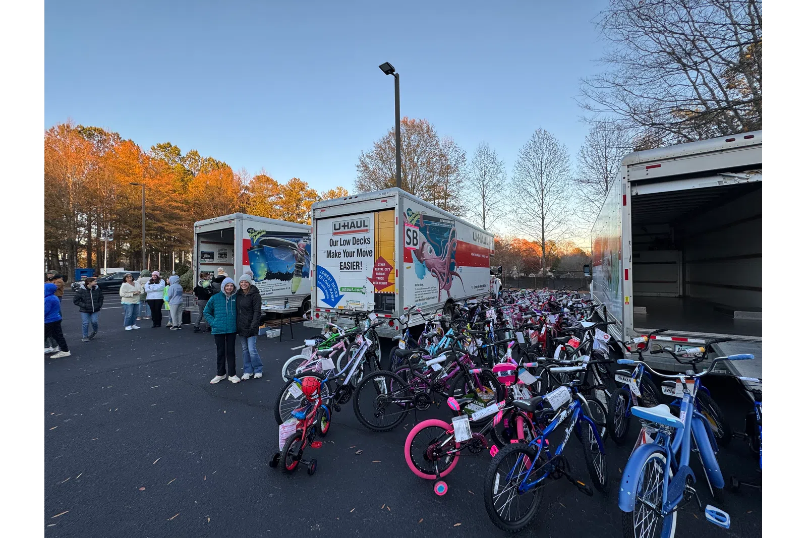 a group of bicycles parked in a parking lot