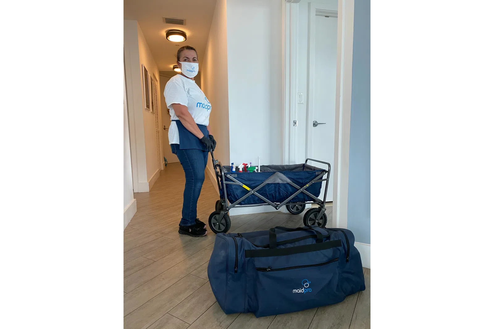 a person with a backpack and a cart