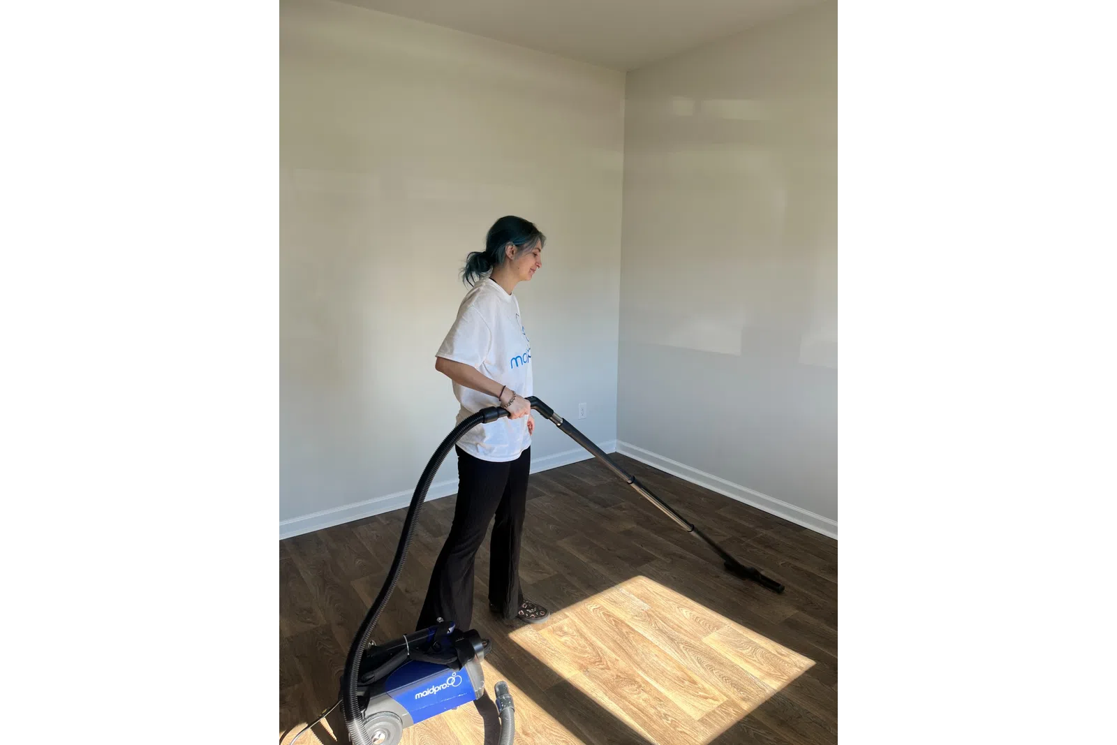 MaidPro Summerville house cleaning PRO vaccuming a floor