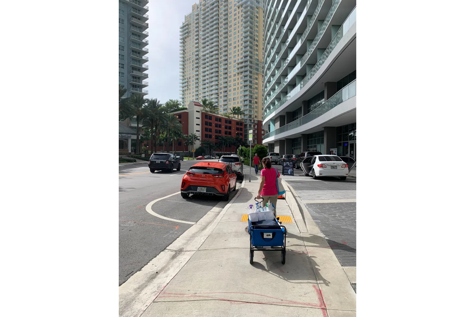 a red car parked on the side of a road
