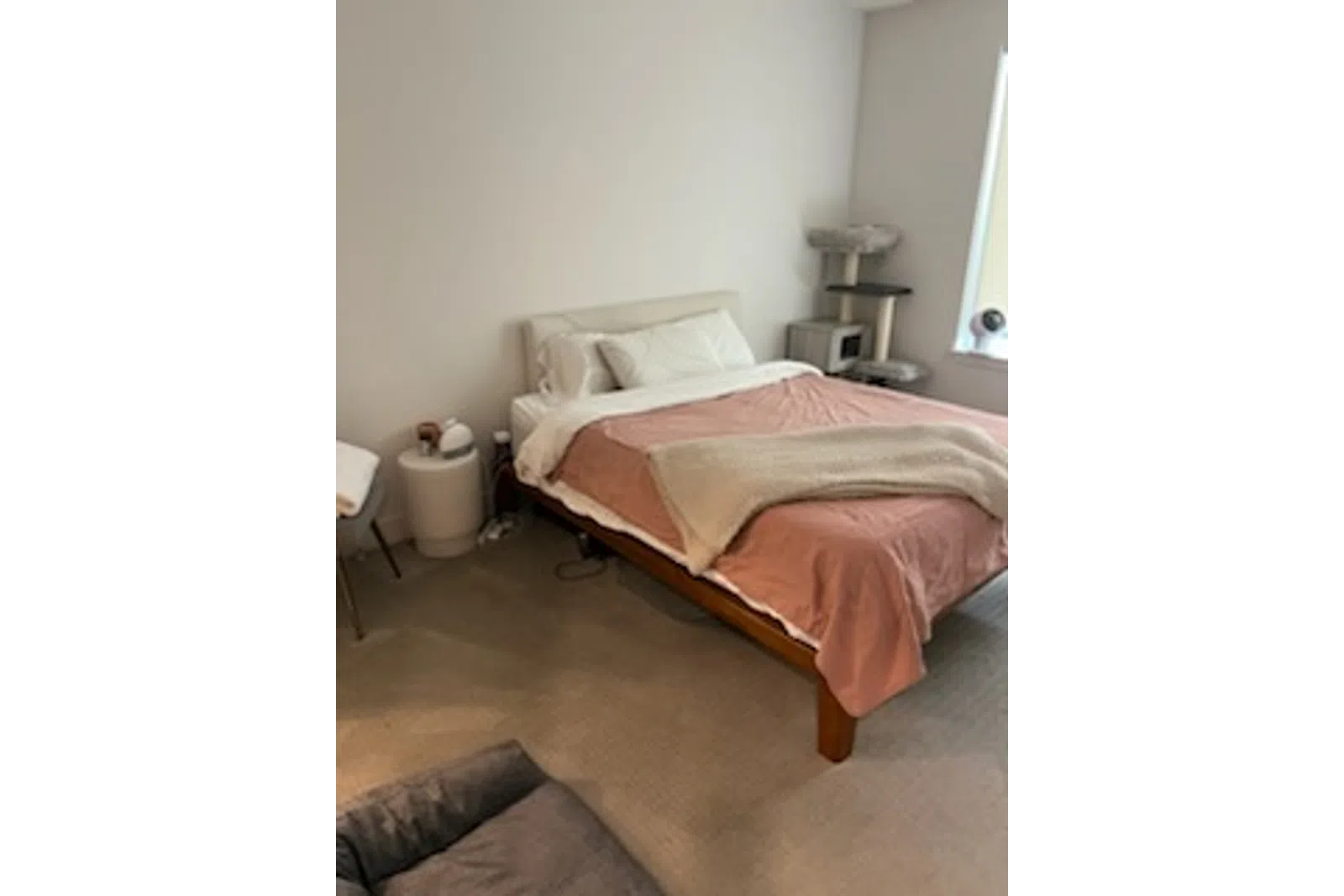 a bed with a brown comforter