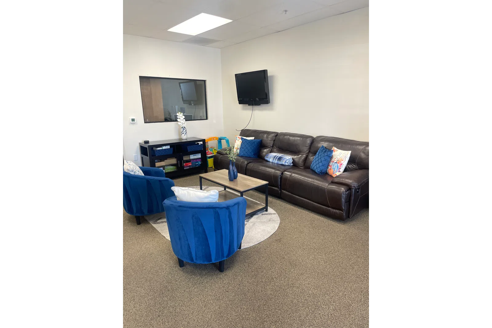 a living room with a couch and a tv