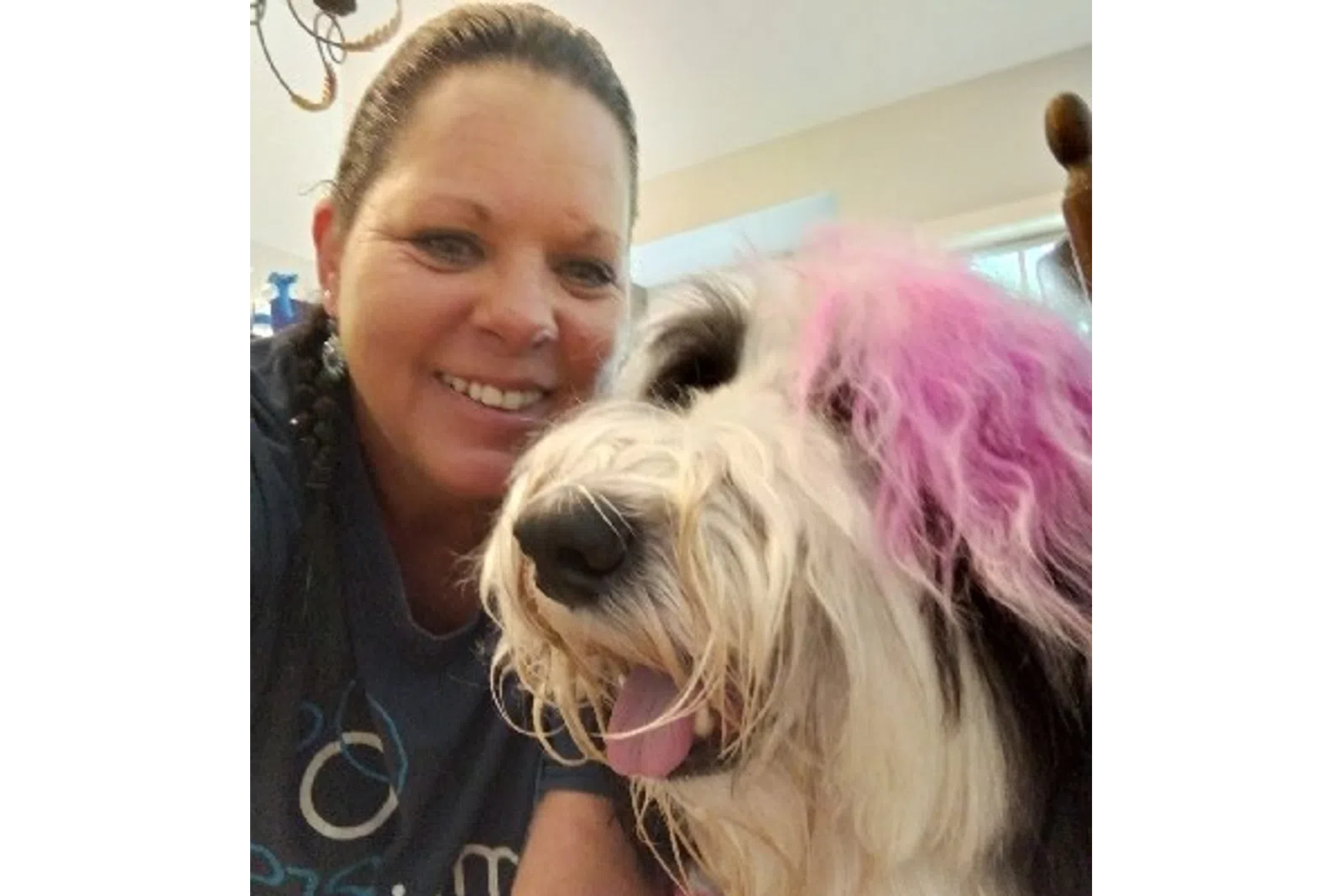 MaidPro Salisbury taking a photo with a customer's dog