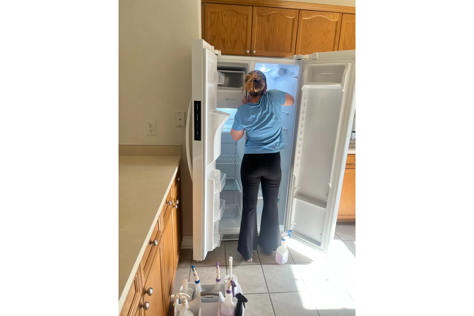 MaidPro house cleaner detailing a refrigerator 