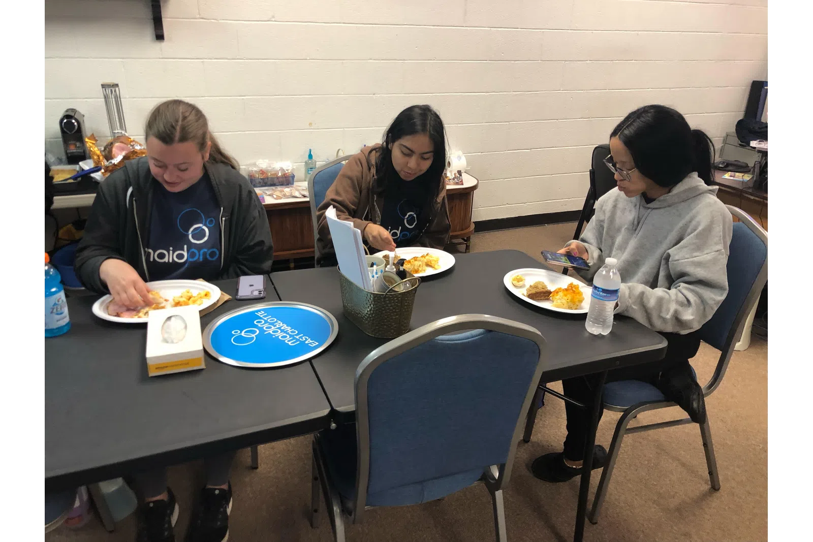 a group of people eating at a table
