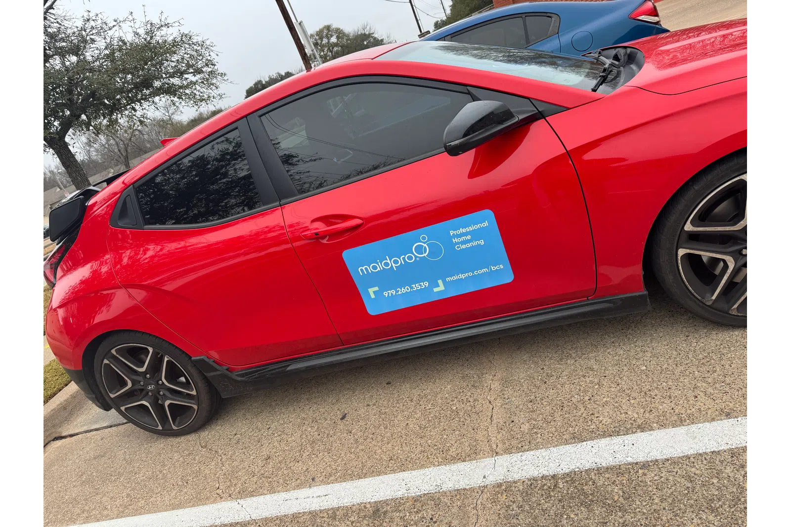 a red car parked in a parking lot